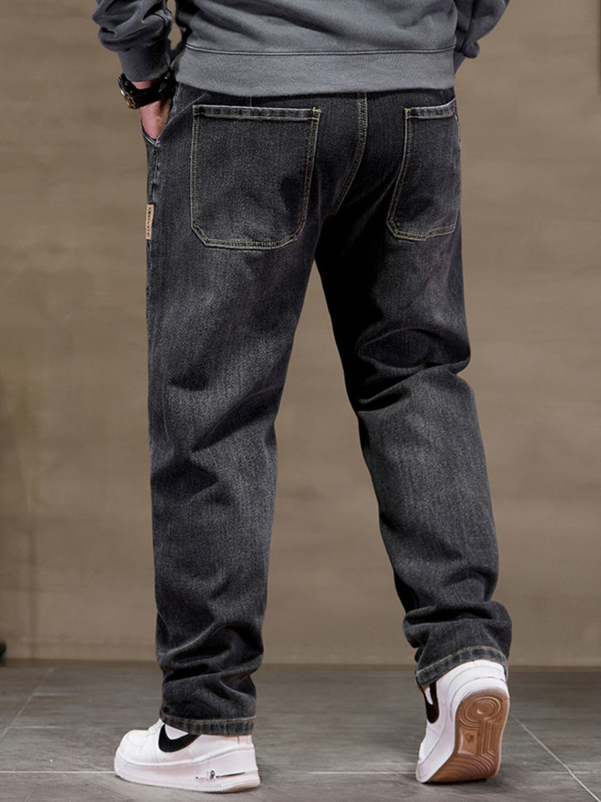 Men's black drawstring cotton jeans with patch back pockets and cuffed hems