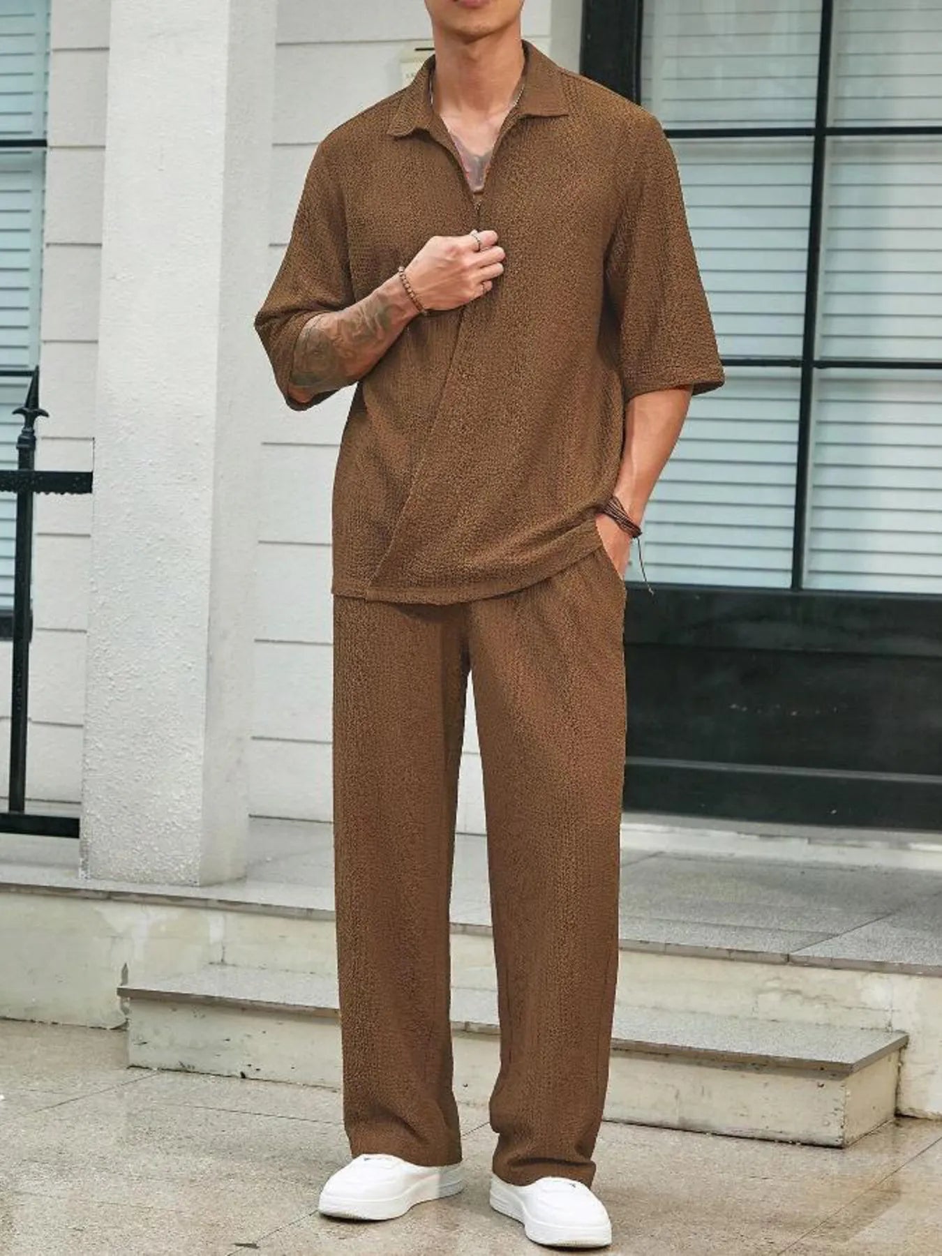 Men's plus size half-sleeve top and pants set, brown; front with hand in chest
