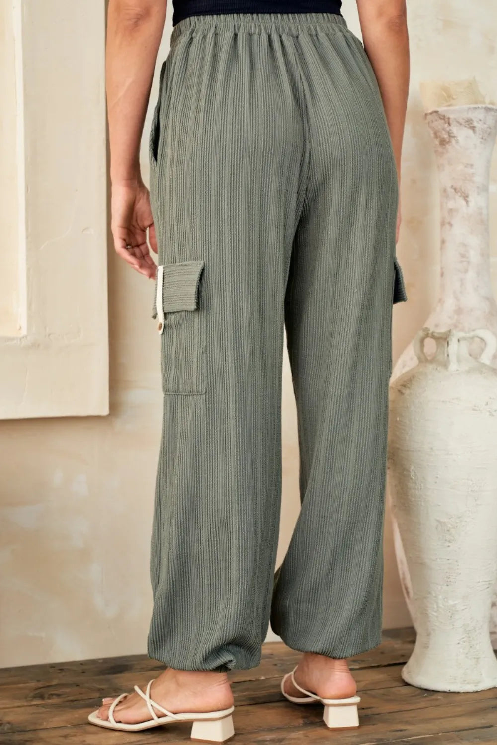 Olive textured rib cargo pants with flap cargo pocket detail and wide straight legs