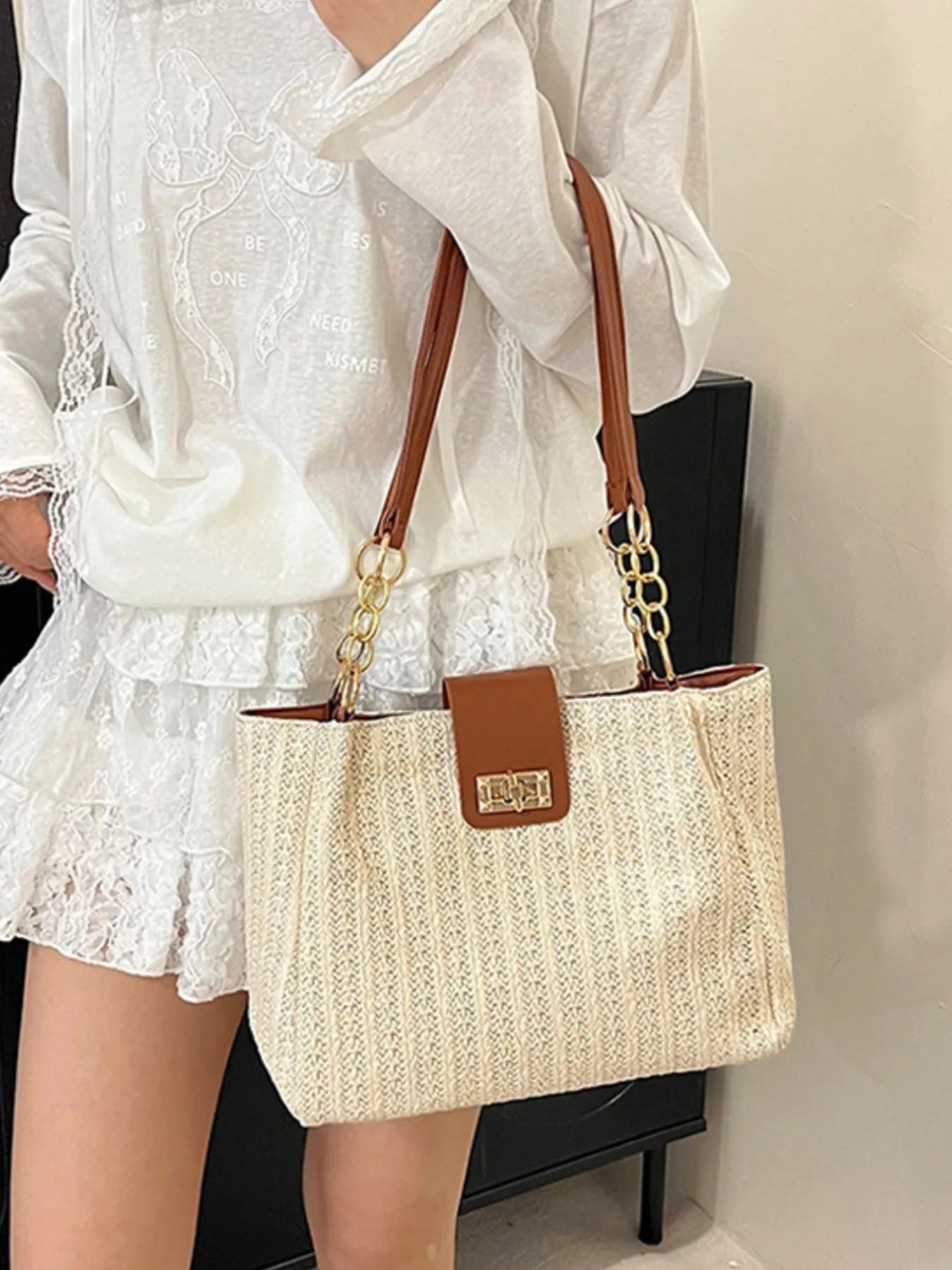 Woven straw shoulder bag with brown leather top handles and gold-tone chain, beige weave