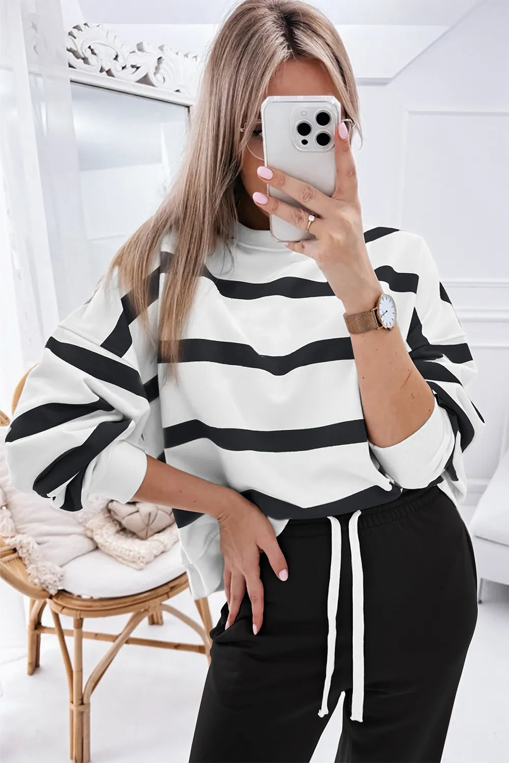 Black-and-white striped long-sleeve top with black jogger pants set, drawstring waist