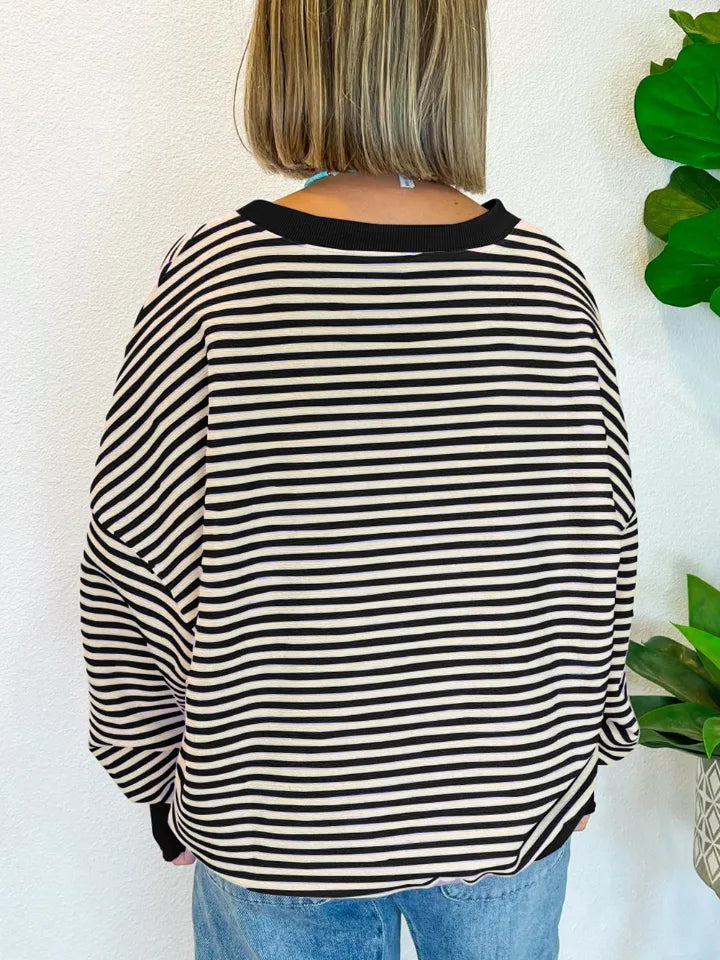 Black-and-white striped long-sleeve sweatshirt with round neck, back view