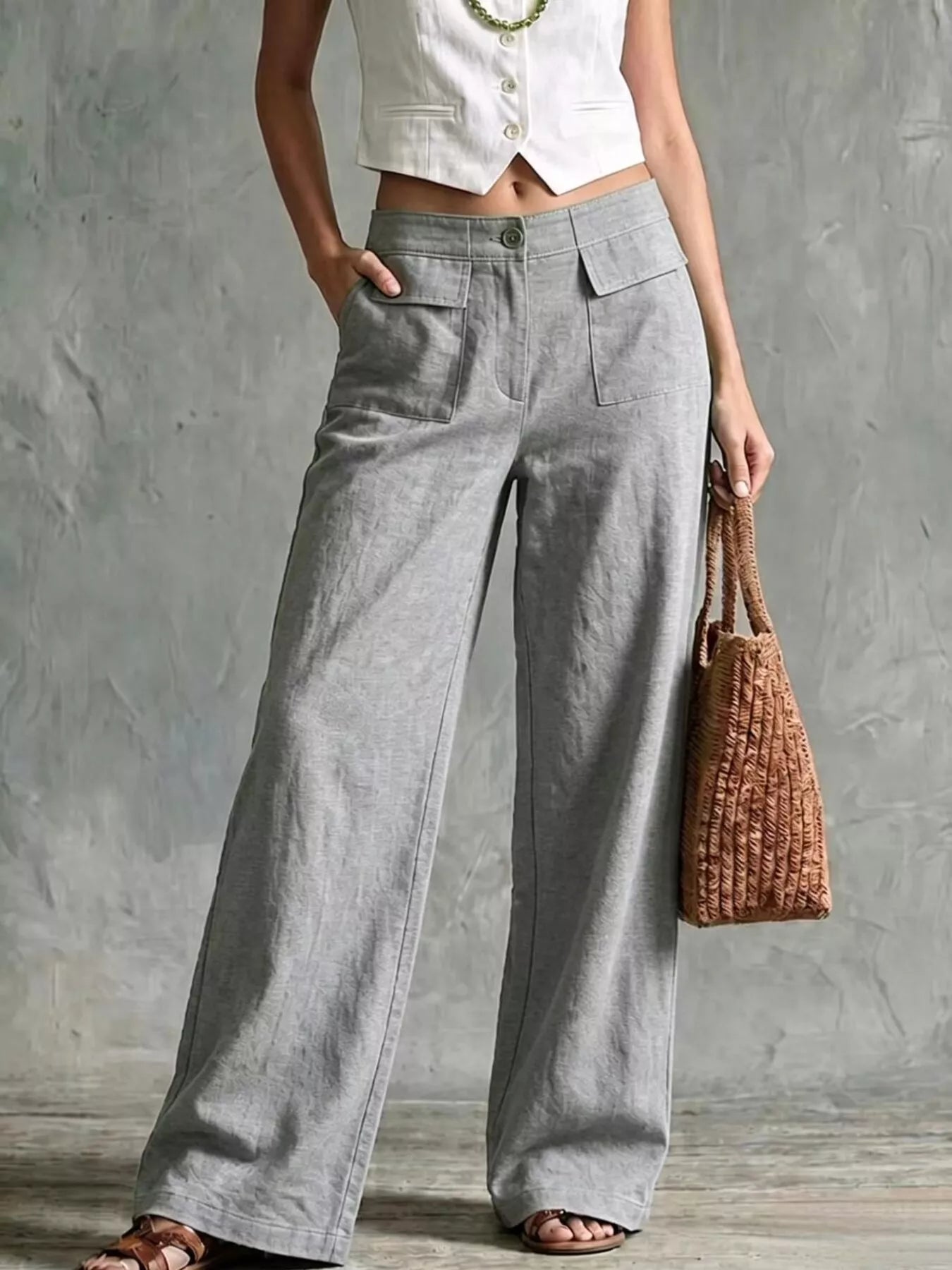 Grey wide-leg pants with front pockets and elastic waistband