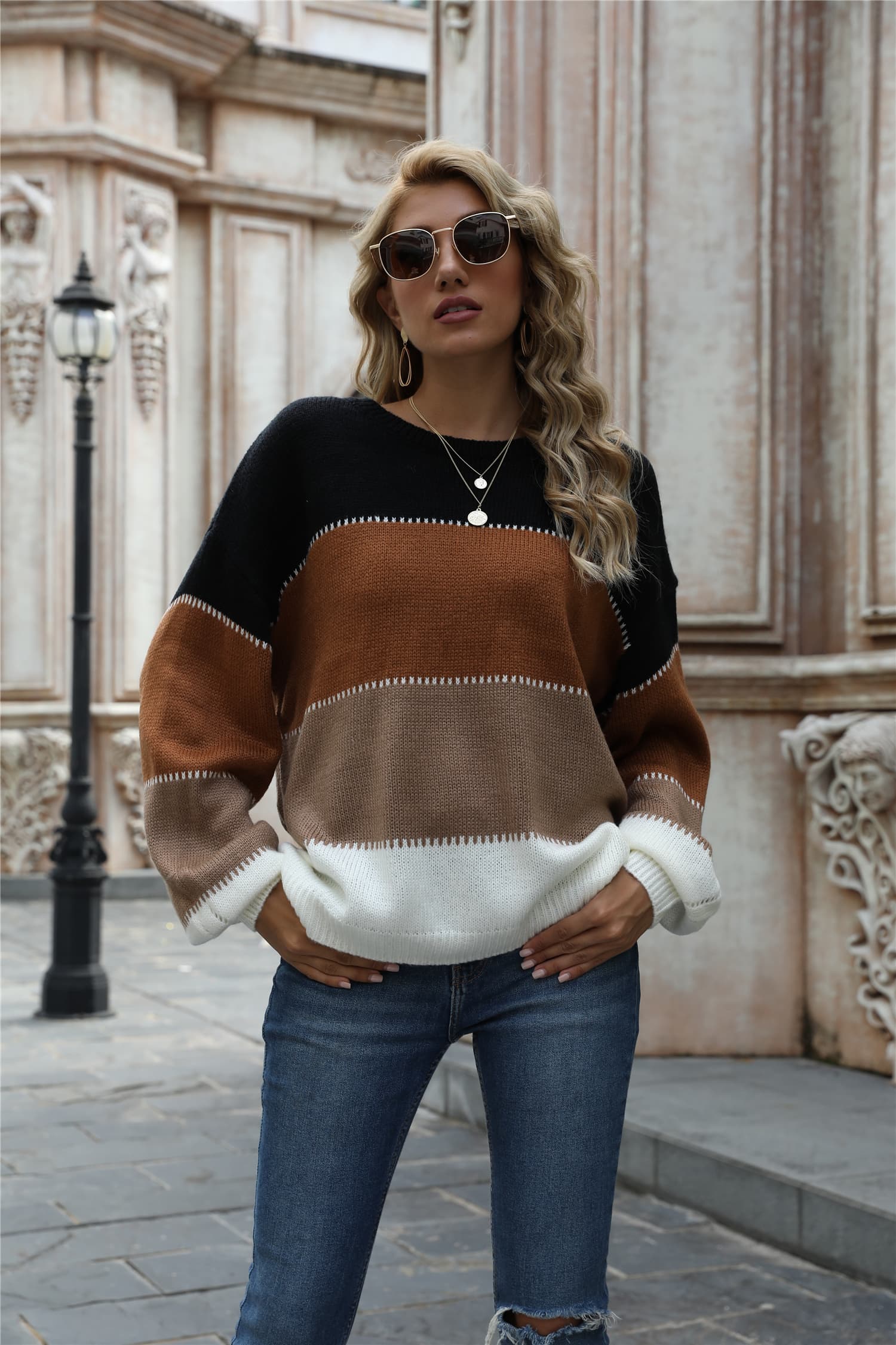 Color block round neck sweater with black shoulders, brown center, white hem and sleeves