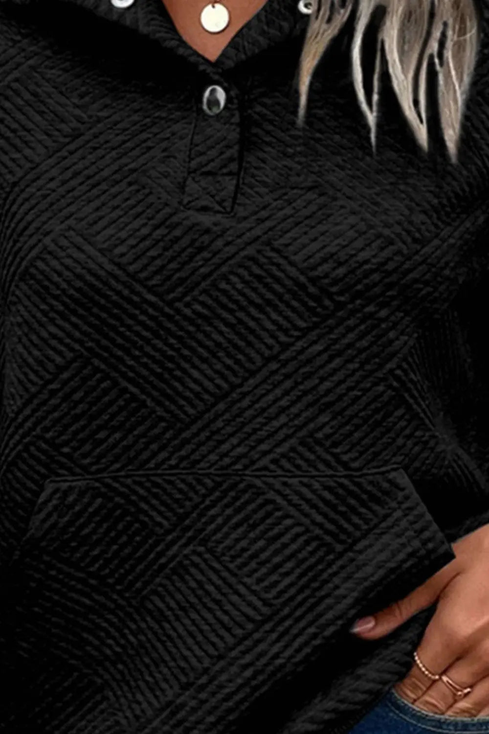 Black long-sleeve sweatshirt with geometric knit texture, V-neck snap buttons