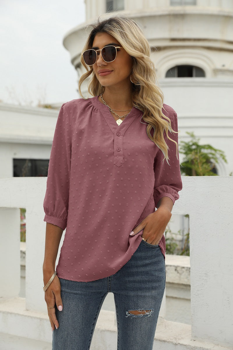 Blush pink swiss dot notched-neck 3/4-sleeve blouse with button placket