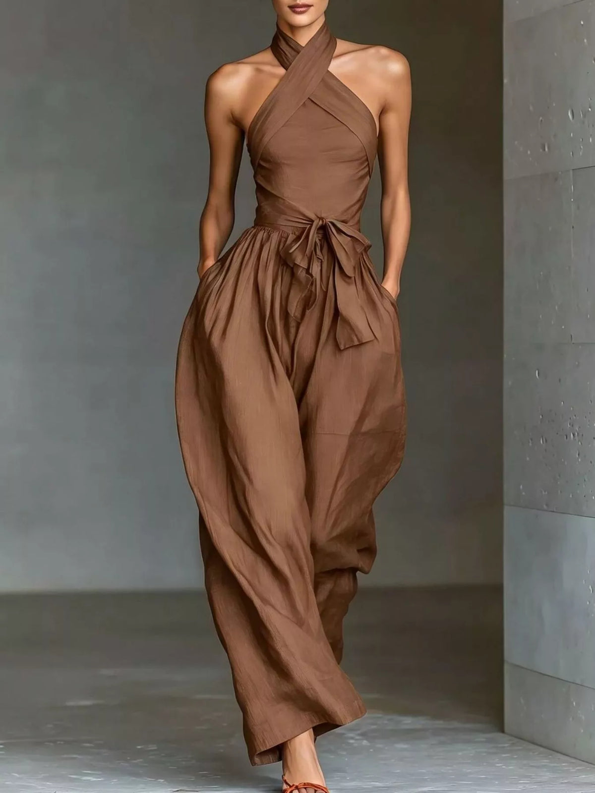 Brown halter neck wide-leg jumpsuit with waist tie and gathered front