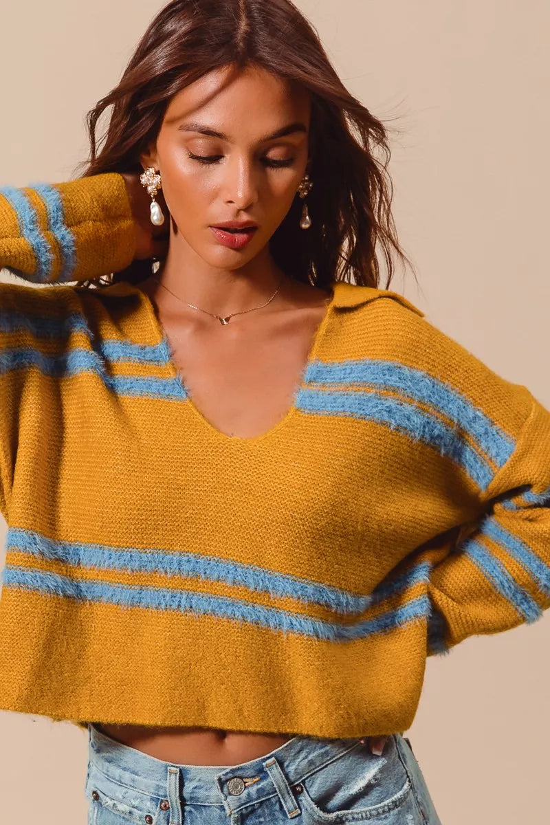 Mustard fuzzy sweater with deep U neck and light blue horizontal stripes