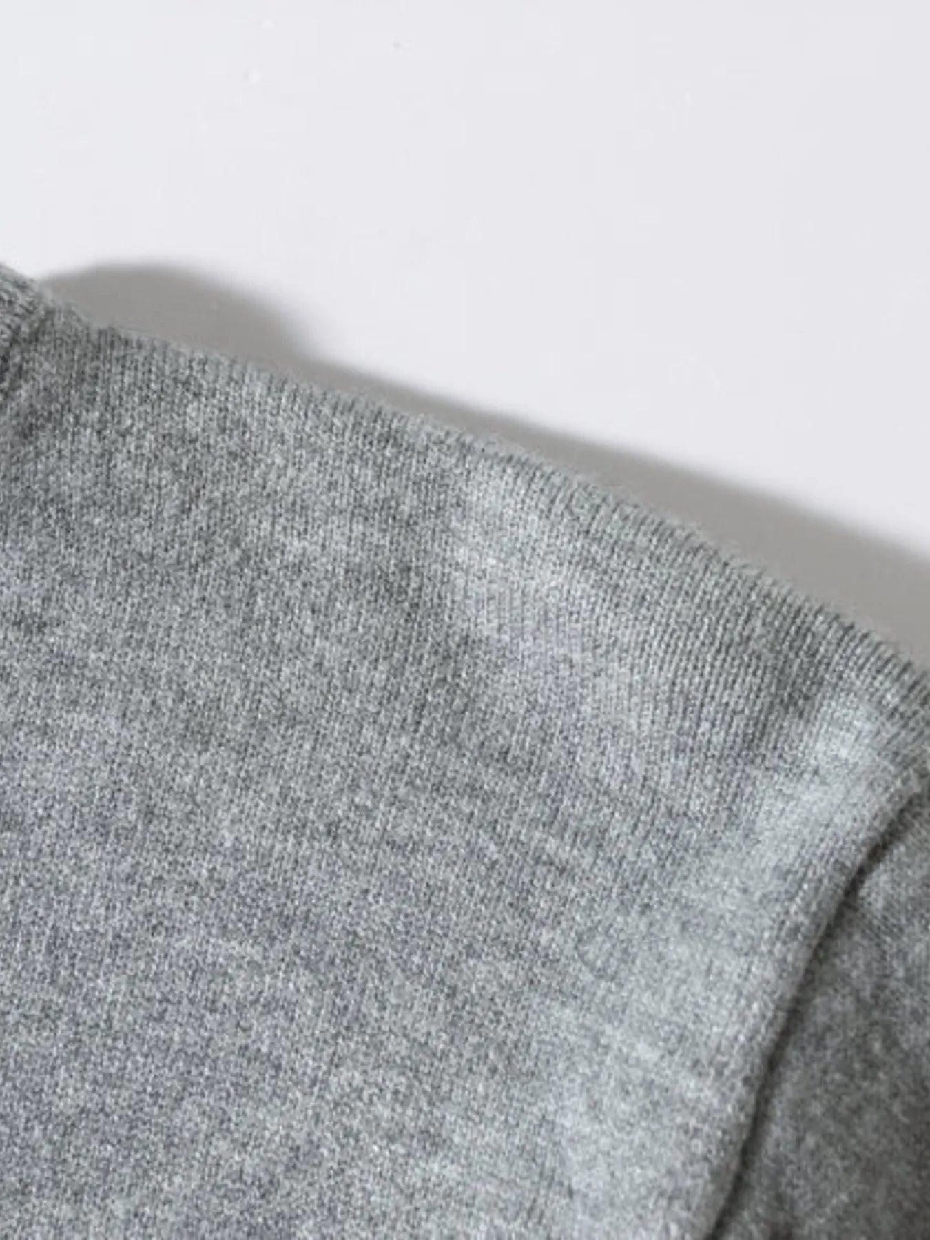 Men's long-sleeve ribbed-hem sweater sleeve knit close-up, gray heather