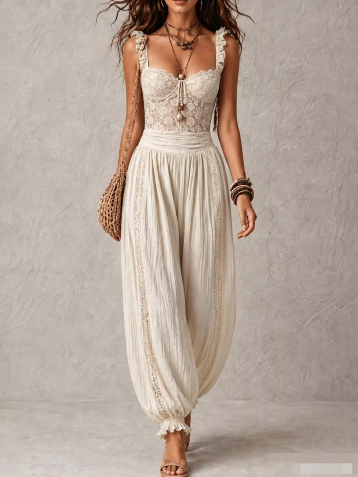 Cream lace corset jumpsuit with scalloped lace trim and gathered harem pants