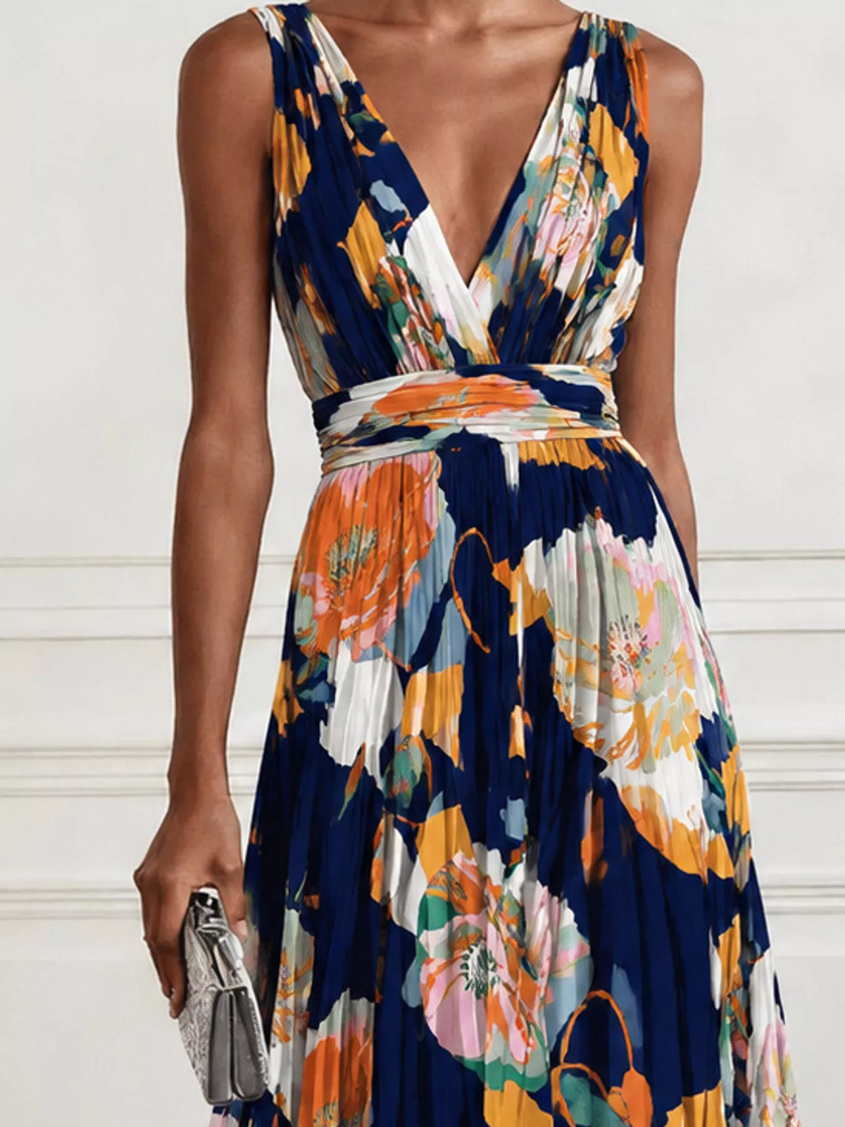 Navy floral print sleeveless maxi dress with V-neck, ruched waist, and draped skirt