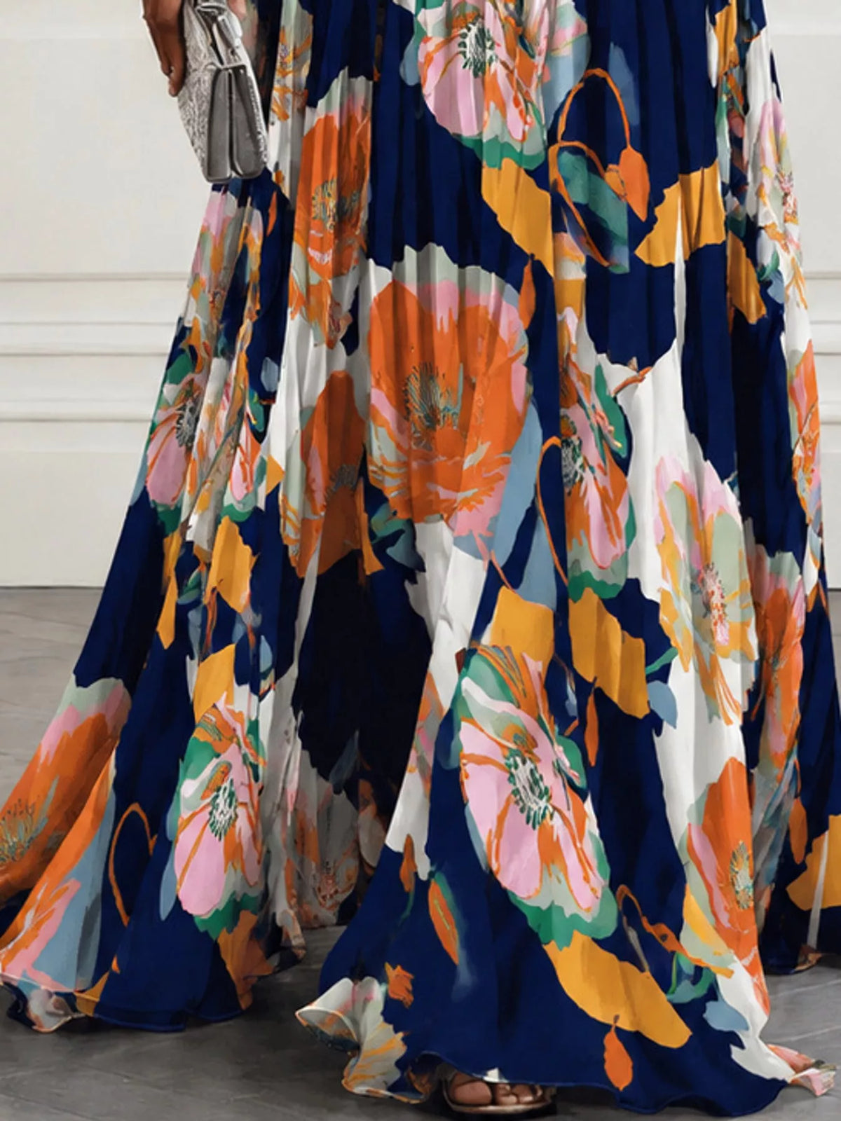 Navy and orange floral print maxi dress with V-neck and ruched waist, full flowing hem