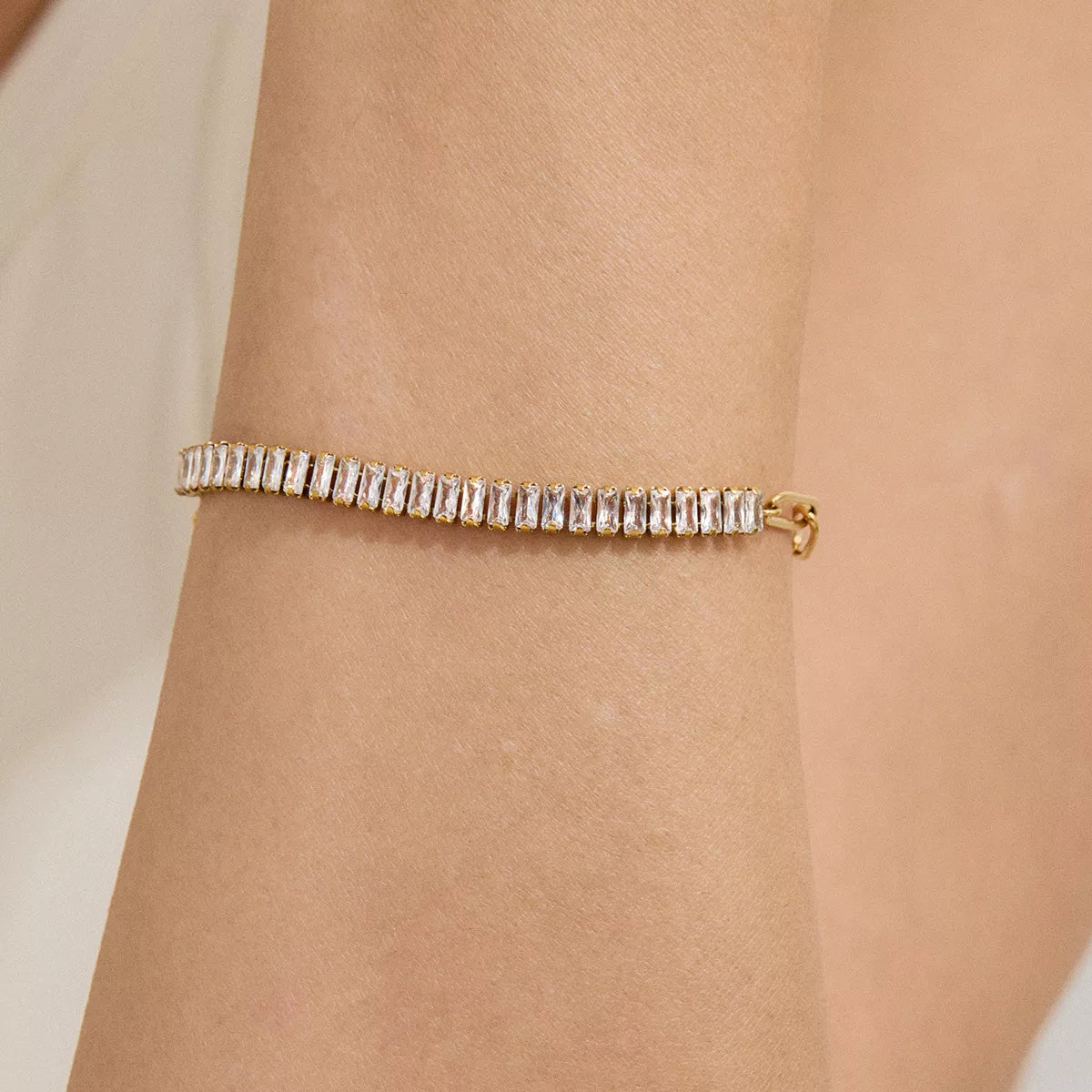Gold-plated rhinestone chain bracelet with clear stones and small box clasp