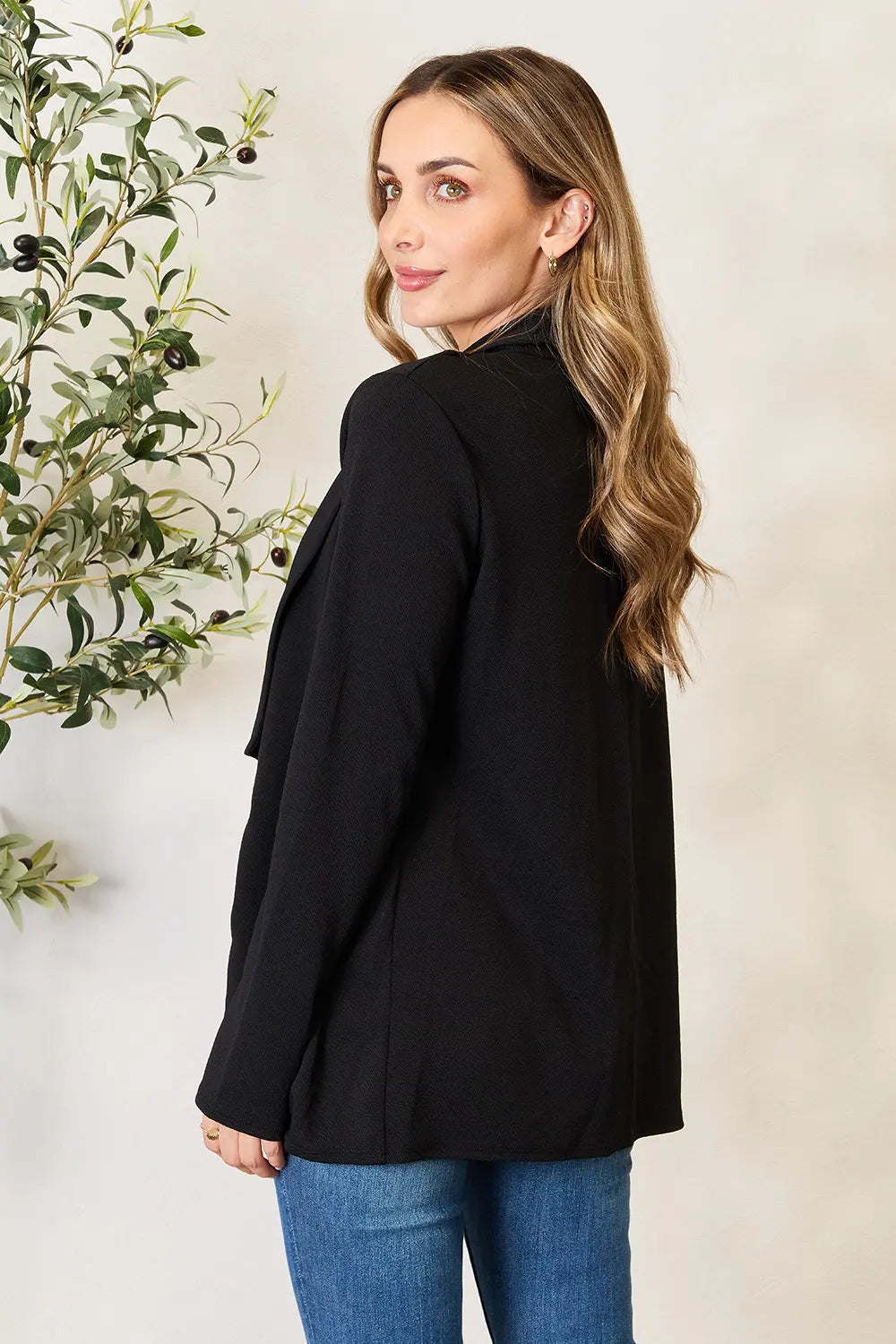 Black long sleeve open-front blazer with structured shoulders and side slits