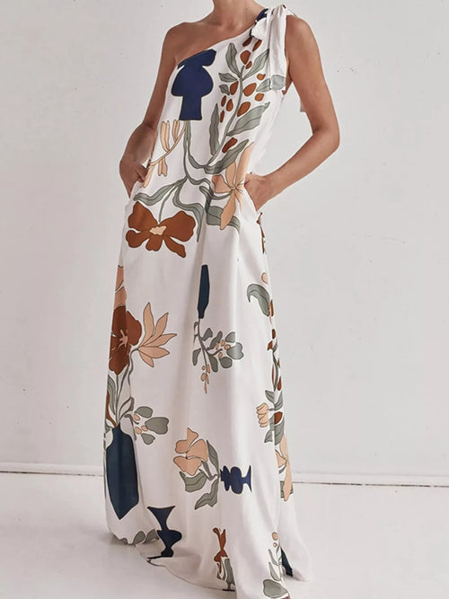 One-shoulder maxi dress in white with bohemian floral print and tied drape detail