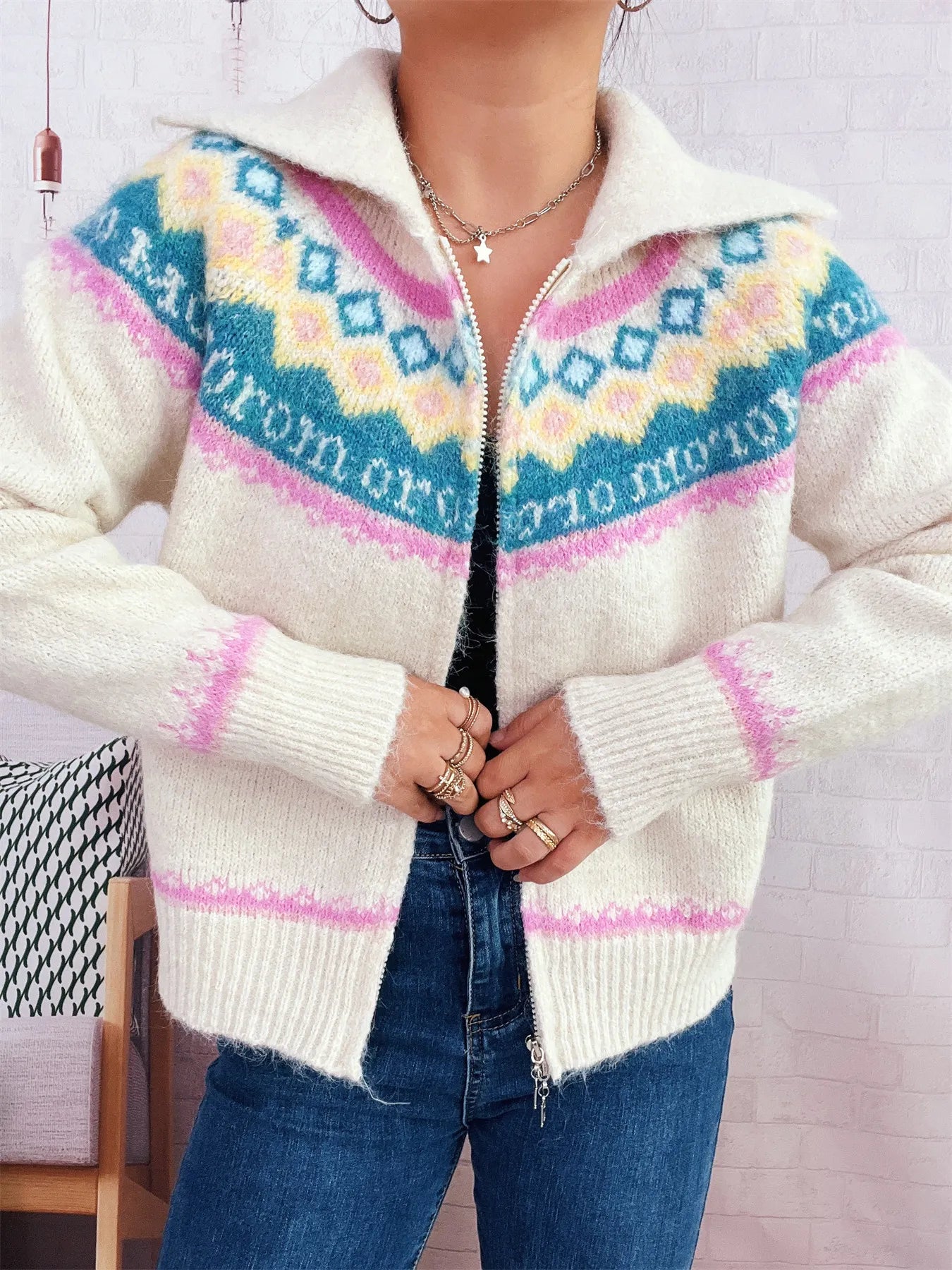 Cream fair isle zip-up cardigan with colorful yoke and ribbed cuffs