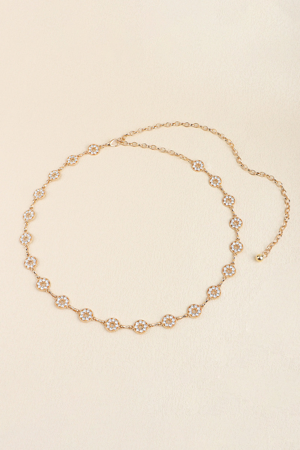 Gold rhinestone chain belt loop with evenly spaced crystal circles