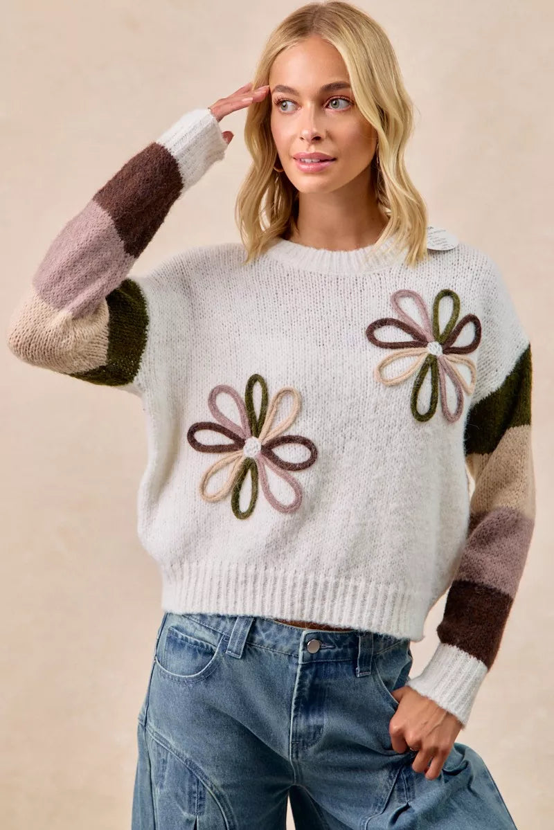 Ivory flower color block sweater with three embroidered flowers and multi-color striped sleeves