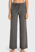 Dark gray wide-leg sports pants with drawstring waist and side pockets