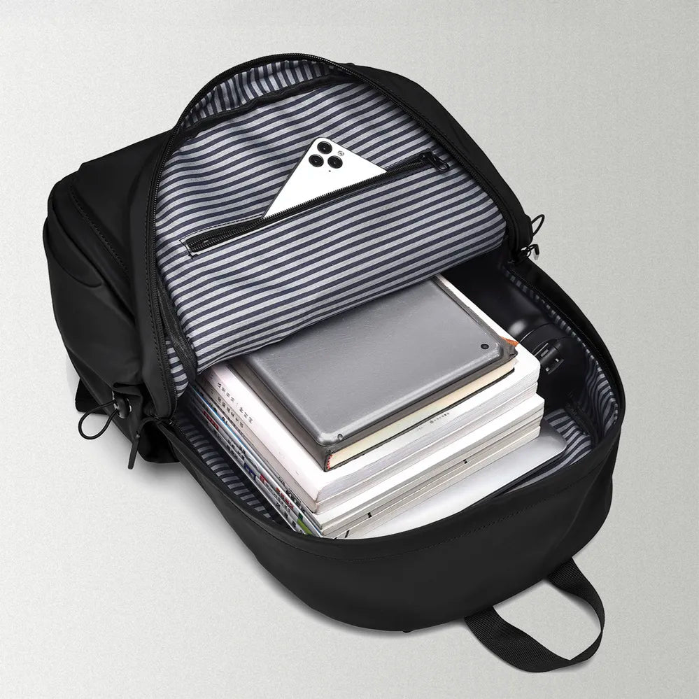Black backpack with striped interior, front compartment, and stacked notebooks