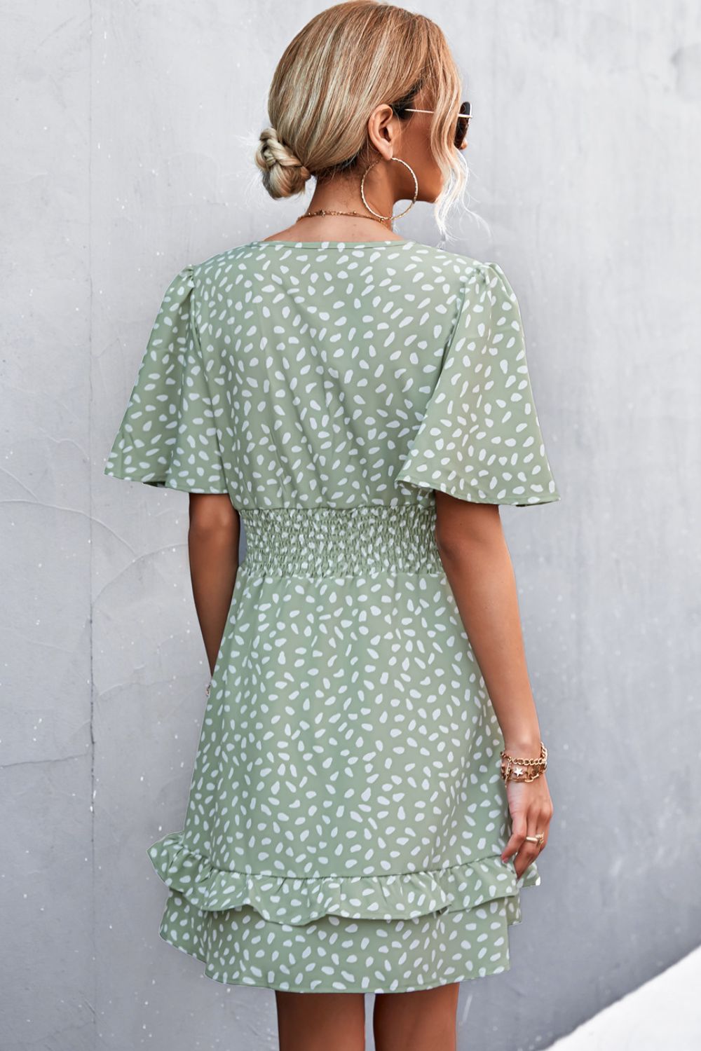Green leaf printed surplice dress with smocked waist and tiered layered skirt