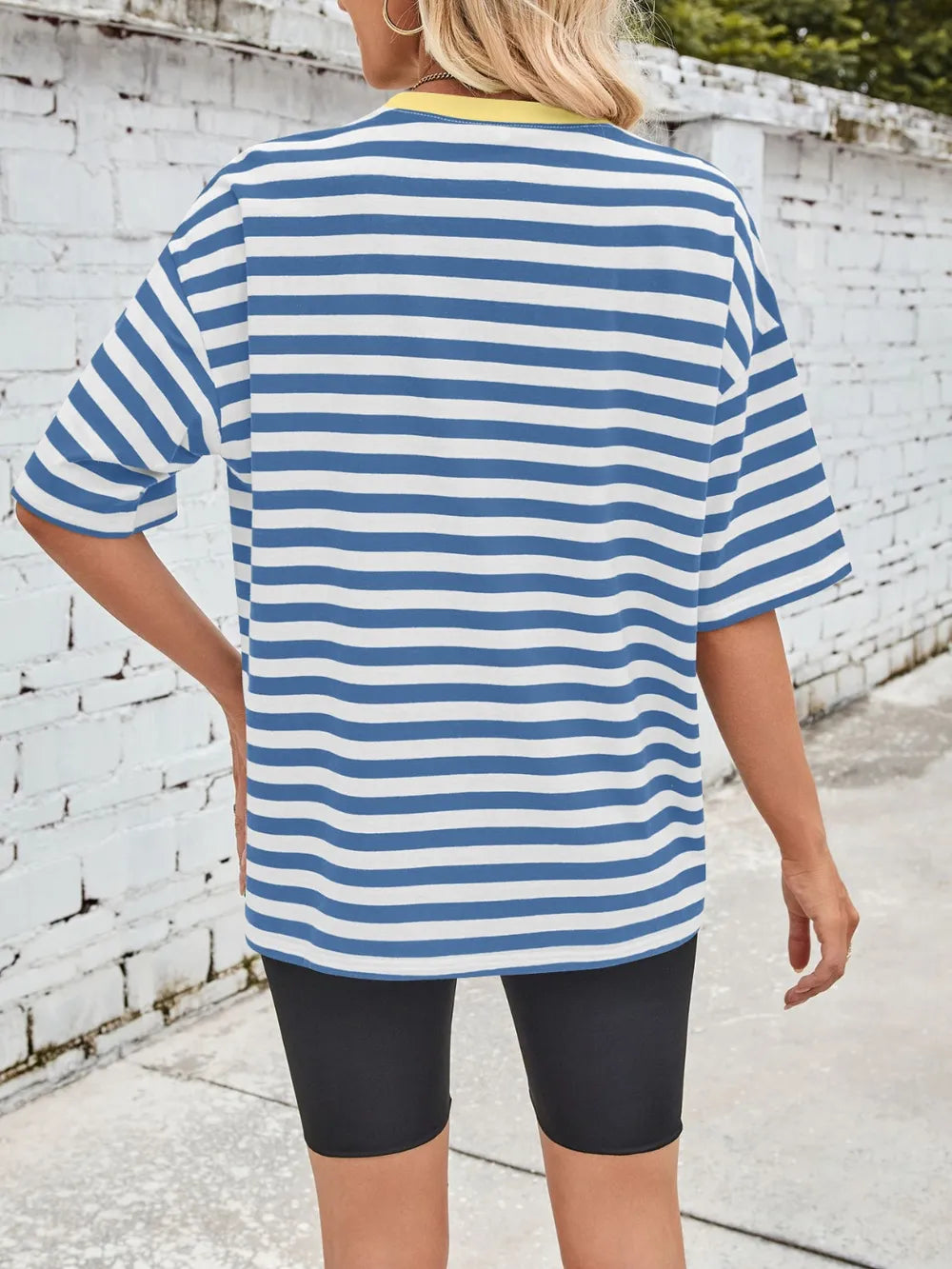 Blue striped round-neck half-sleeve T-shirt, slightly oversized fit, back view.
