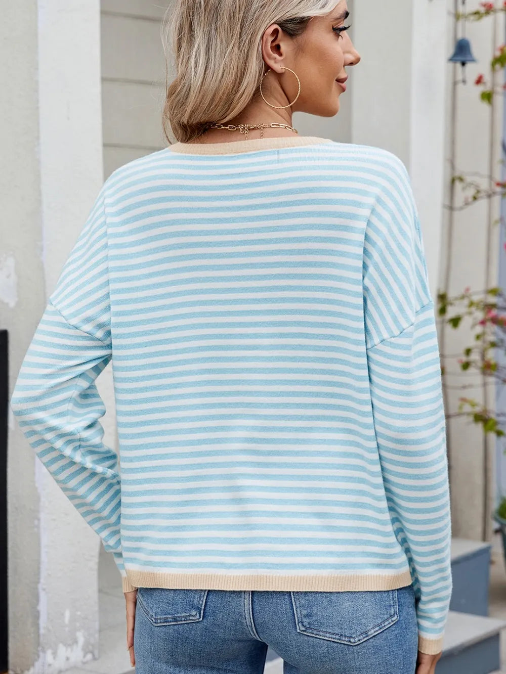 Striped contrast round-neck long-sleeve sweater, back view, light blue and white stripes