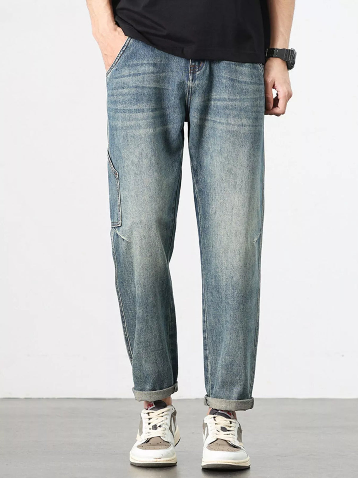 Relaxed-fit vintage washed blue jeans, straight wide legs and cuffed hems.