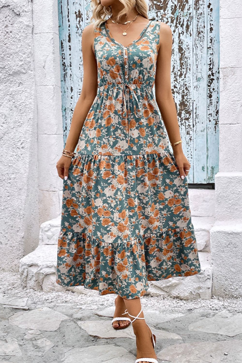Floral V-neck tiered sleeveless midi dress with button-front detail, orange and teal.