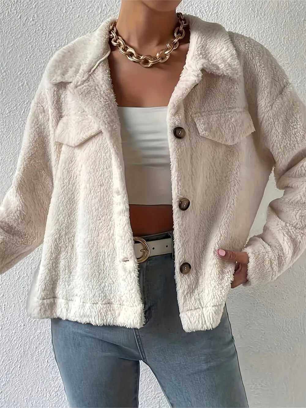 Beige sherpa collared button-up jacket with flap pockets and button front