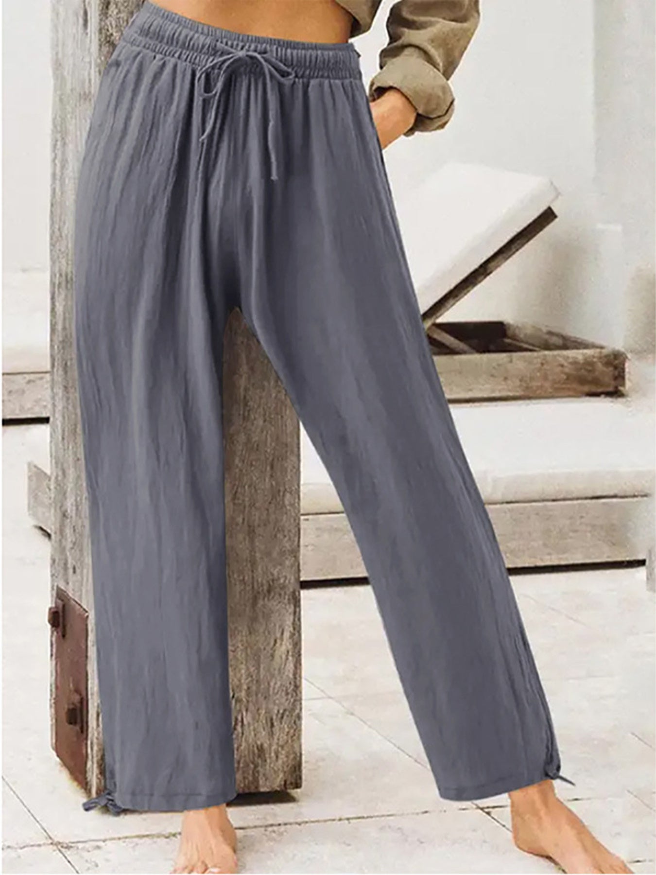 Gray-blue wide-leg drawstring pants with elastic waist and relaxed flowy legs