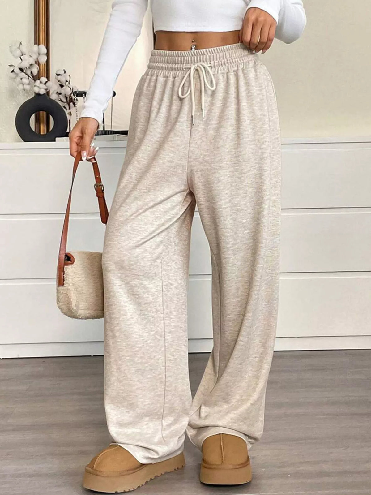 Women's high-waist drawstring wide-leg pants in light heather, elastic waist with ties.