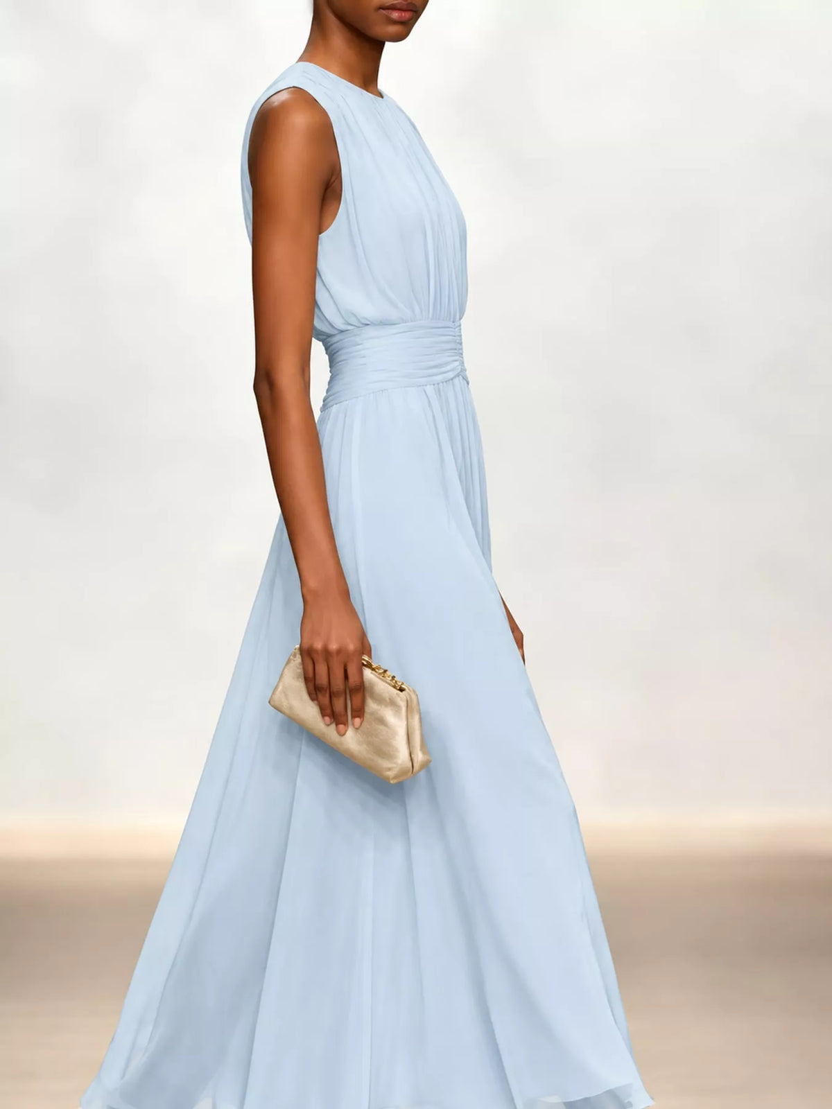 Light blue sleeveless chiffon maxi dress with ruched waist and draped skirt