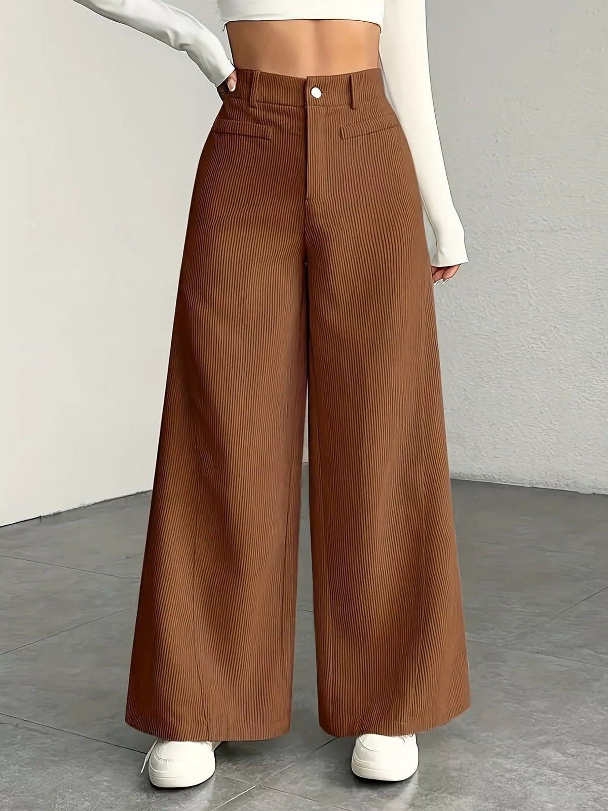 Pocketed high-waisted wide-leg pants in dark brown with front button closure