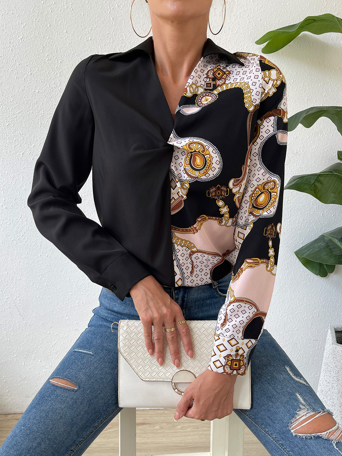 Black twist-front collared blouse with long sleeve and ornate patterned panel front