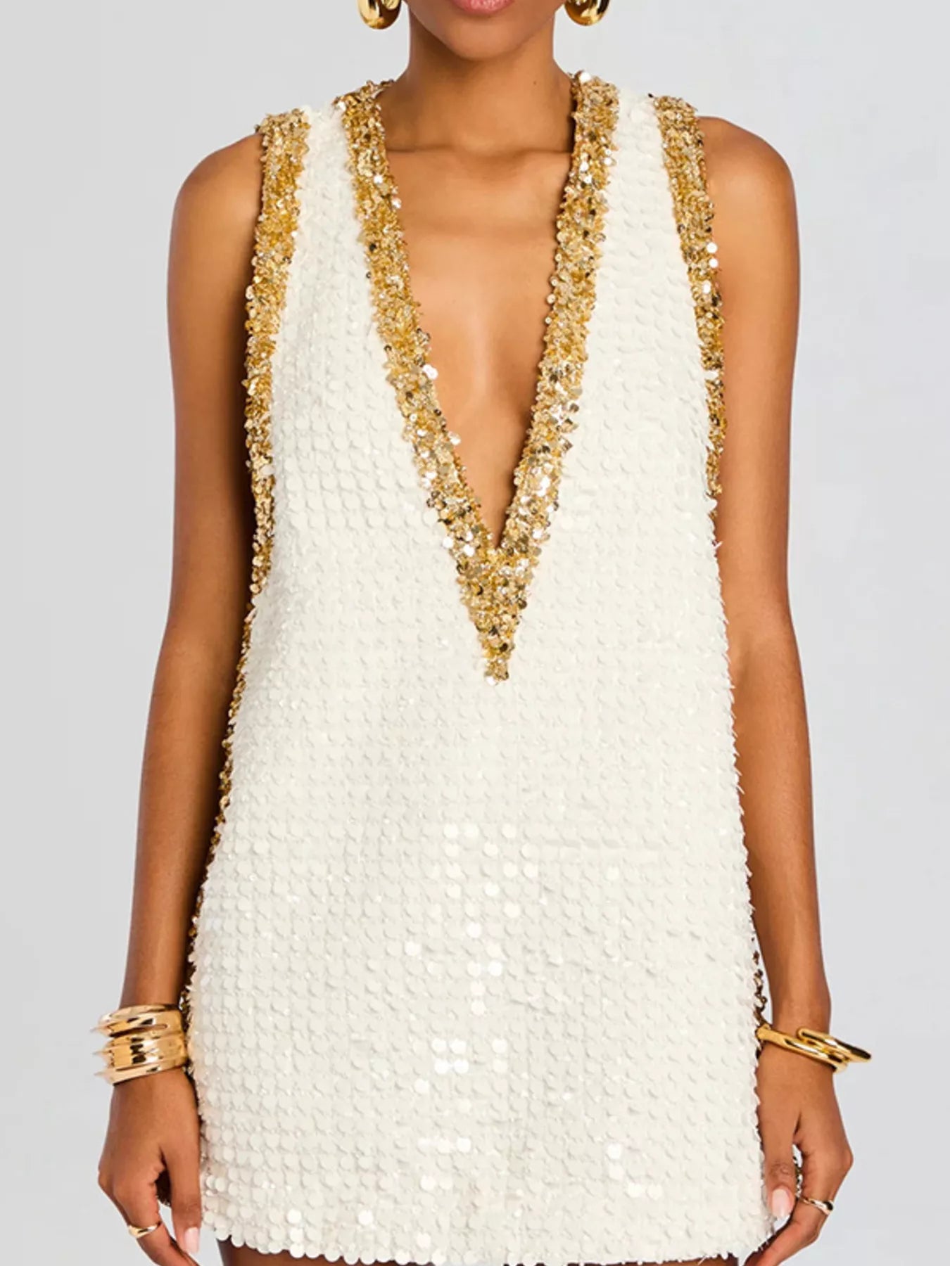 Cedar & Moore Sequin Embellished Sleeveless Mini Dress by Trendsi in white with gold sequin trim and V-neck.