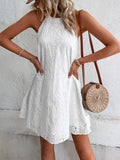 White eyelet mini dress, sleeveless Grecian neckline with scalloped embroidered pattern