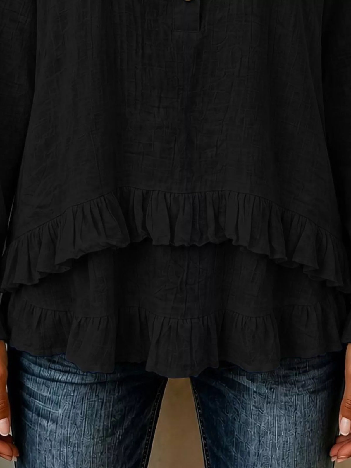 Black long sleeve blouse with layered ruffled hem