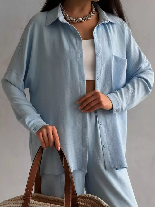 Light blue button-down shirt with chest pocket and front buttons; matching loose pants