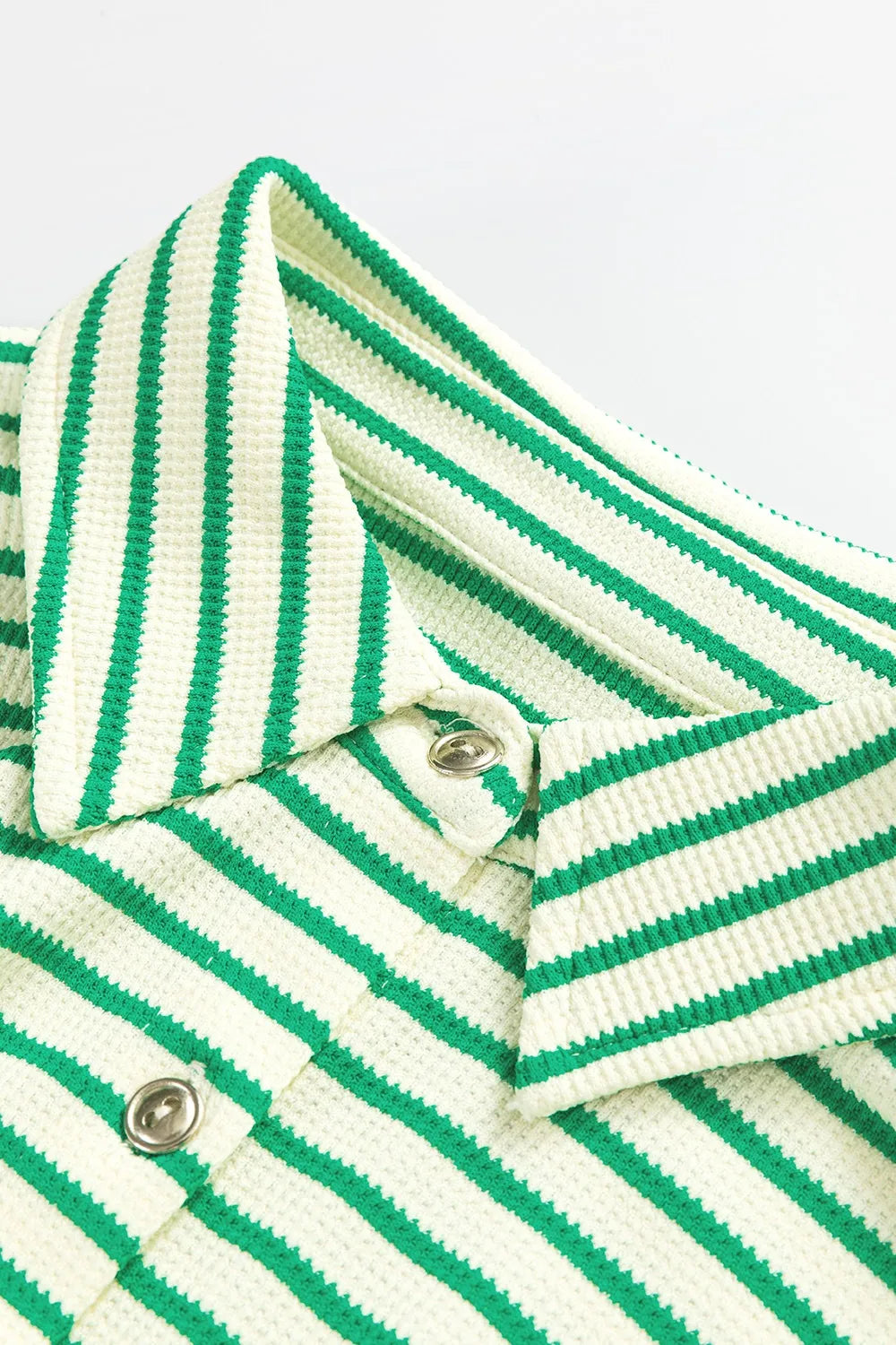 Green-and-white striped romper with buttoned V-neck placket and ribbed trim