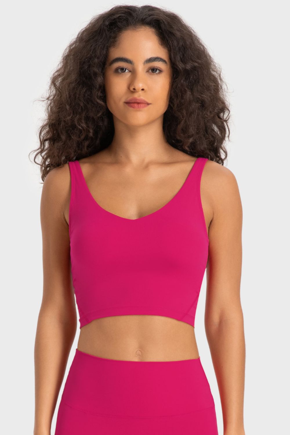 Hot pink deep V-neck crop sports bra with racerback straps
