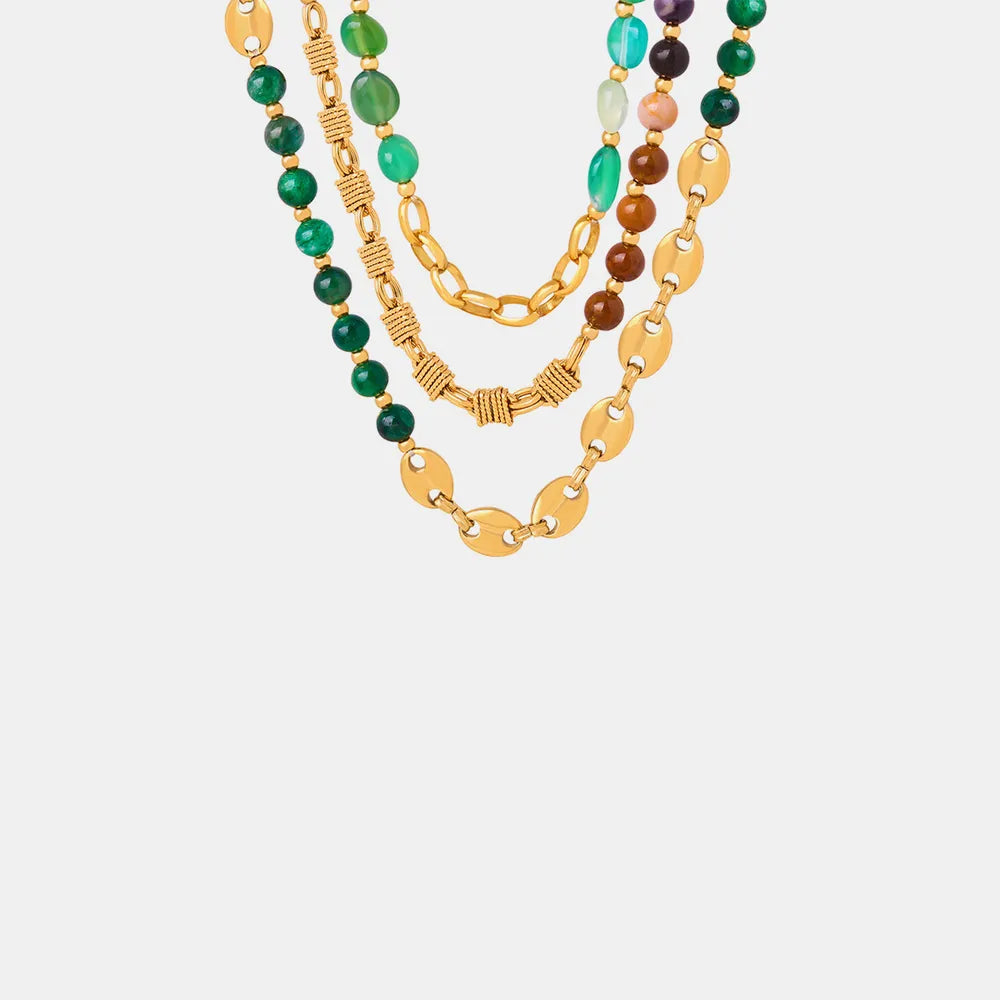 Layered beaded necklace with gold chain links and green, brown, and pastel beads