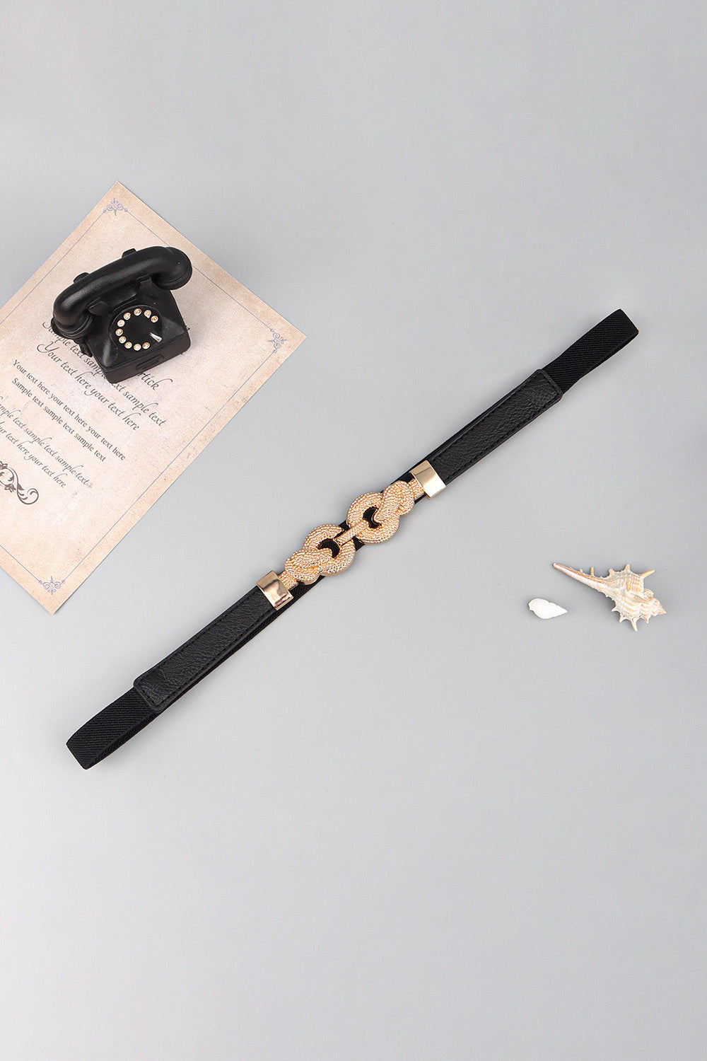 Black vegan leather belt with zinc alloy buckle and braided oval chain link detail