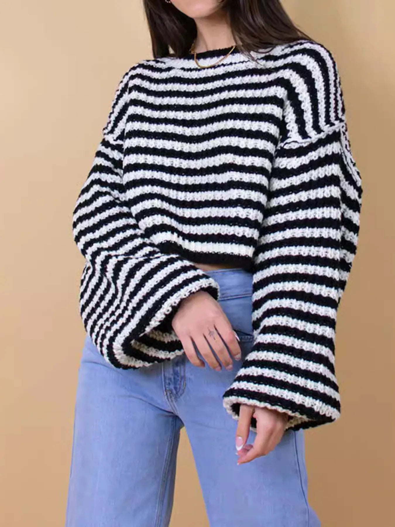 Black-and-white striped oversized drop-shoulder sweater, ribbed round neckline