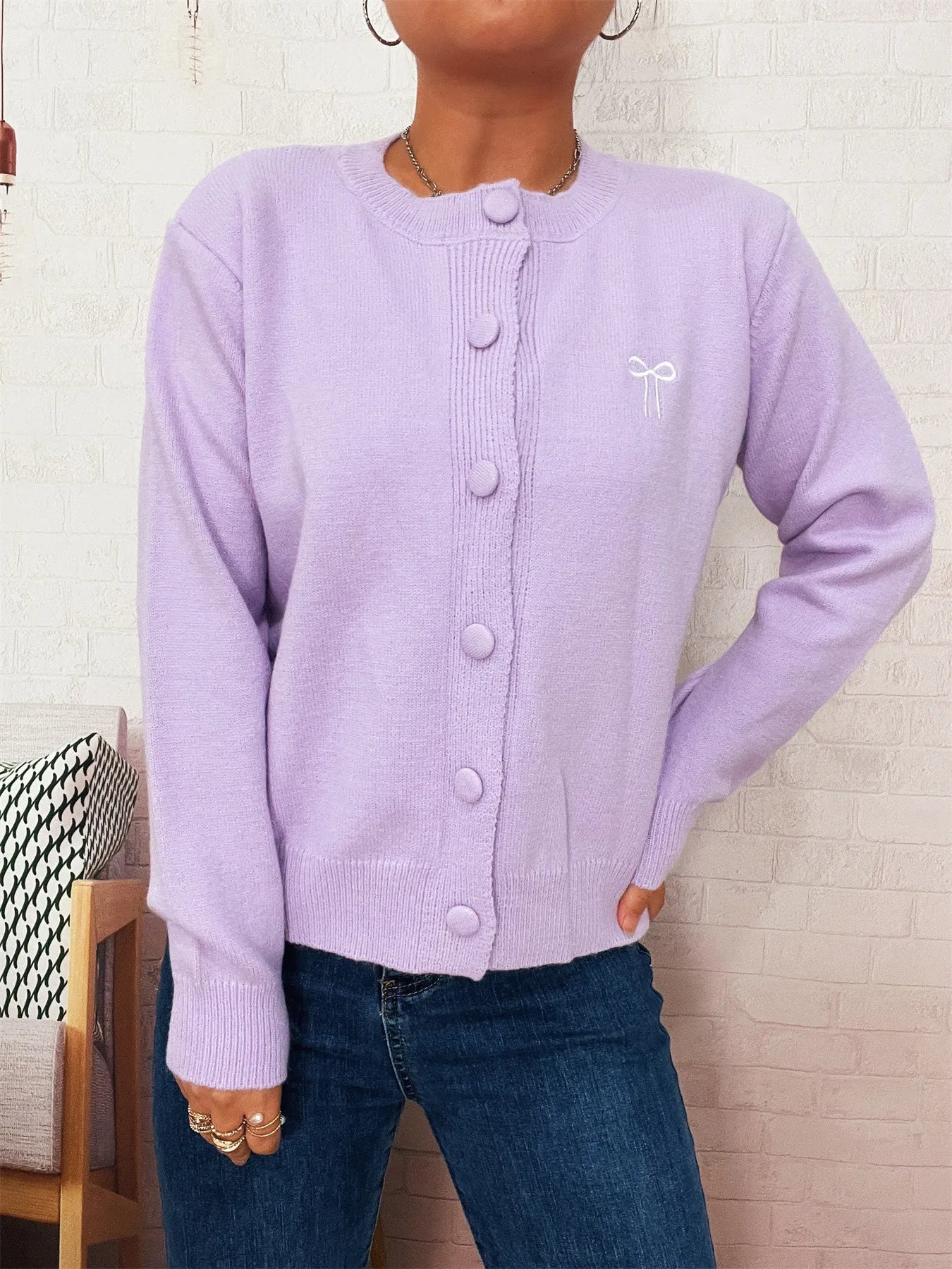 Lavender button-up cardigan with long sleeves and round button front
