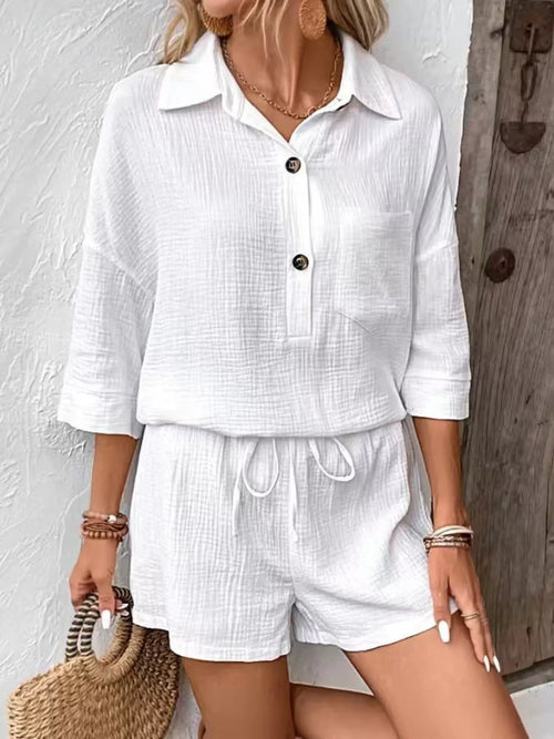 White button-front top with collar and chest pocket paired with shorts, drawstring waist.