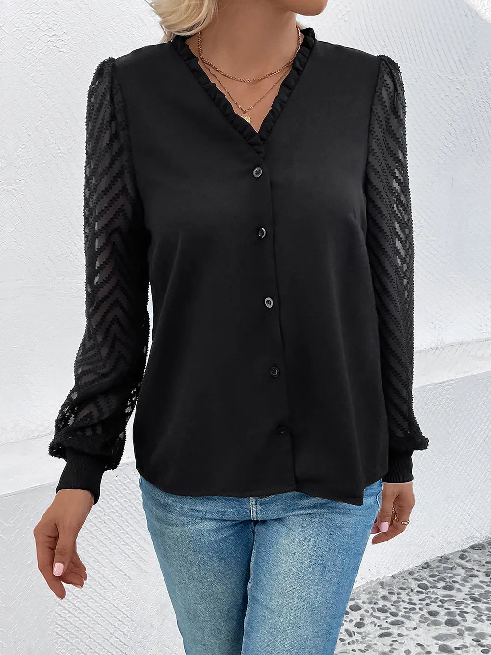 Black V-neck button-front blouse with sheer mesh sleeves and relaxed fit through torso