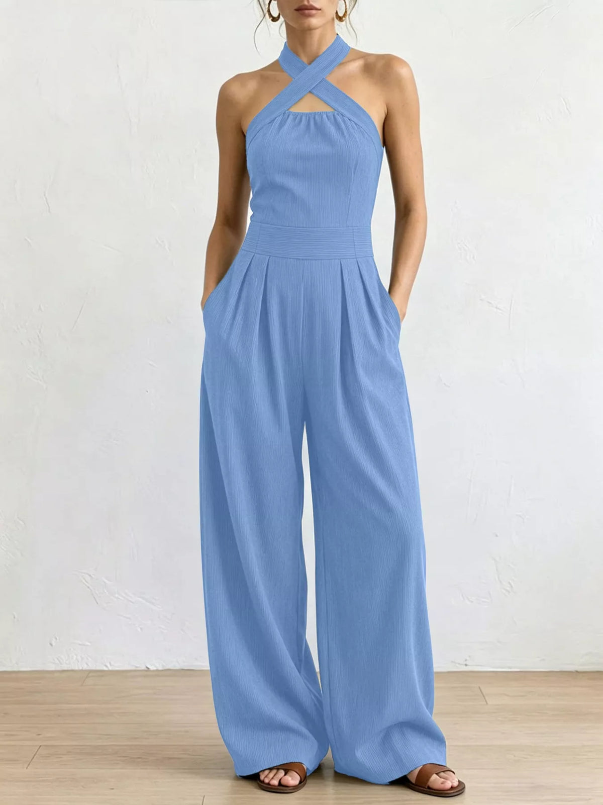 Light blue halter linen jumpsuit with high waist and wide-leg pants