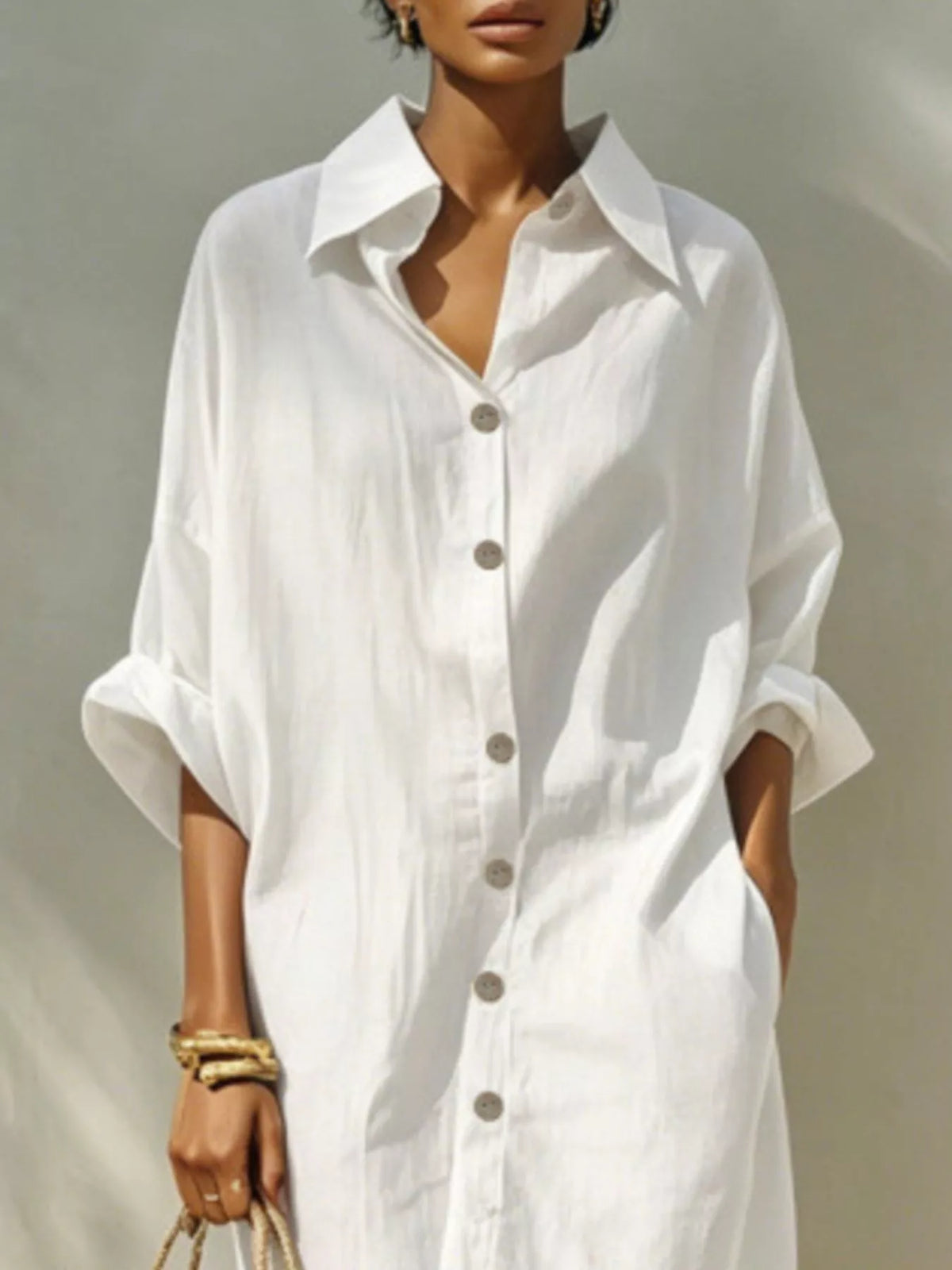White collared shirt dress with button placket and draped short sleeves