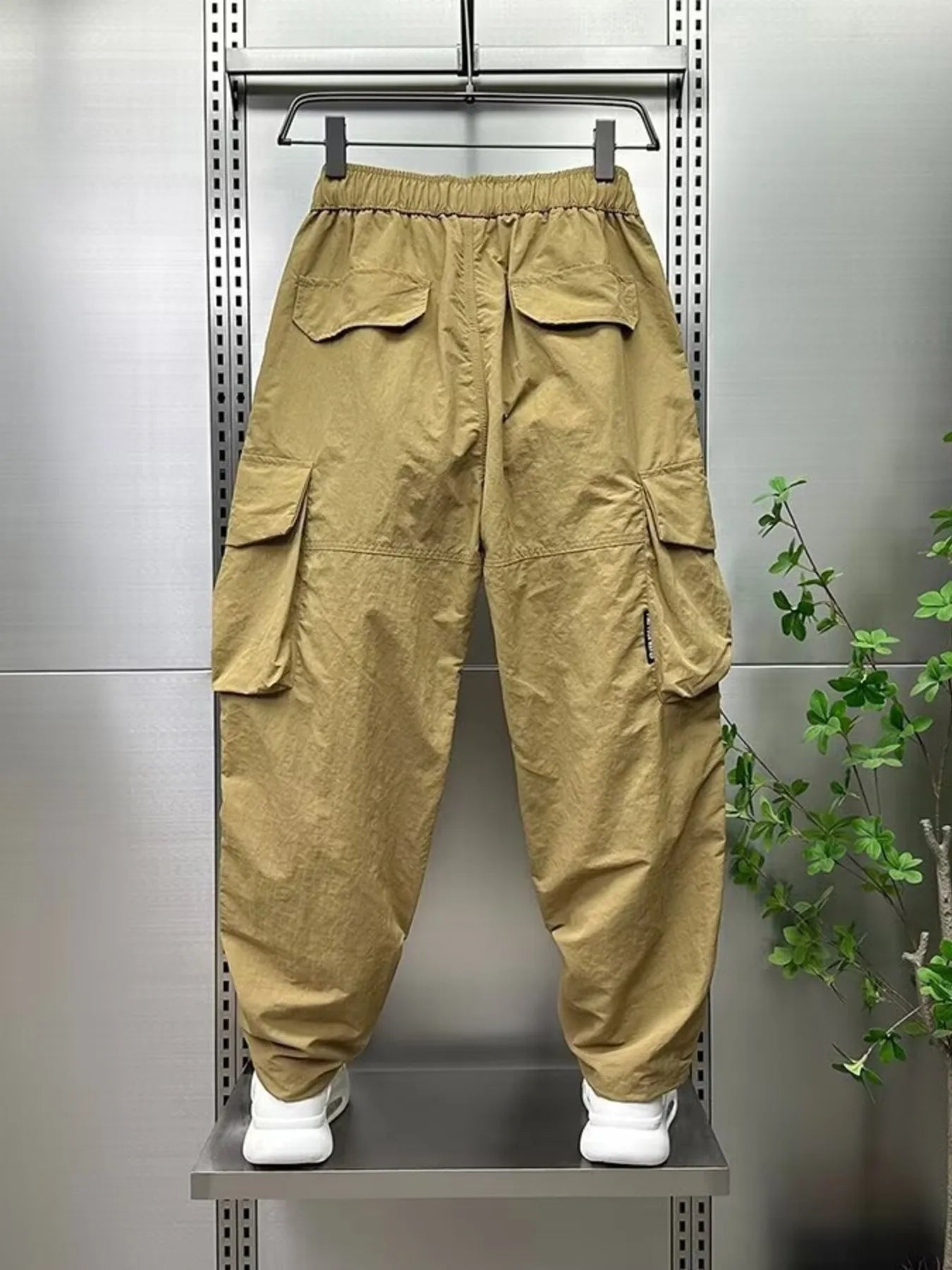 Men's plus size drawstring cargo pants, wide-leg, khaki with cinched cuffs and flaps.